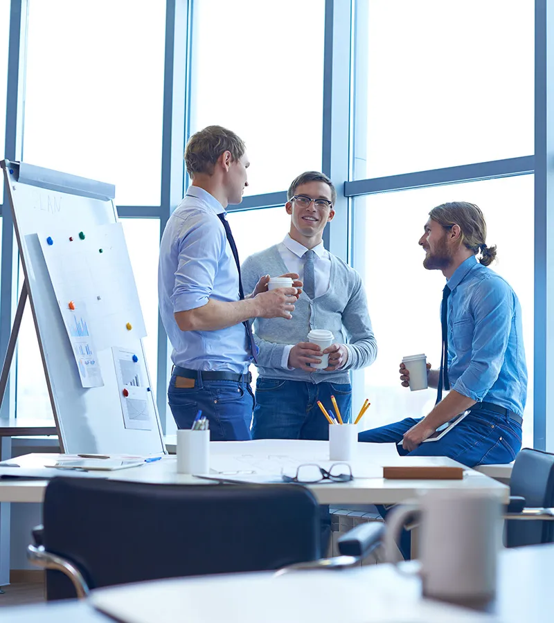 Business professionals in a meeting discussing technology solutions